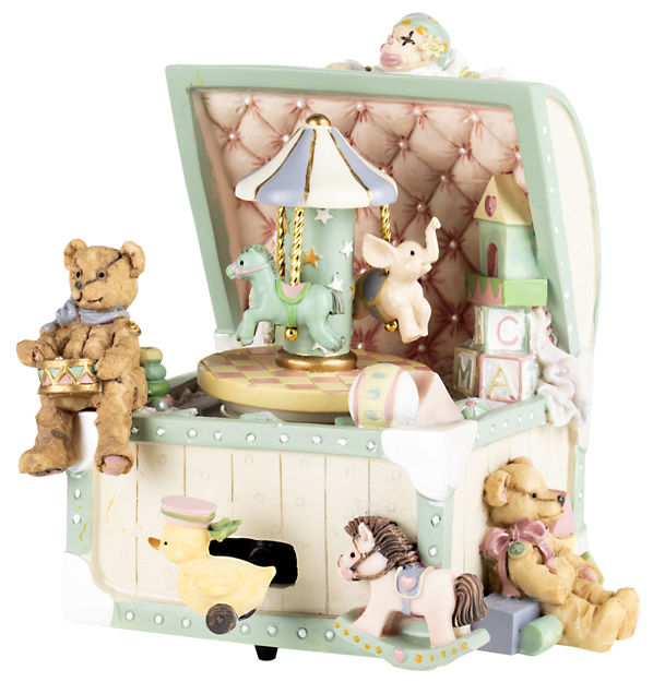 A decorative toy music box with an open trunk-style lid, featuring pastel green trim, a pink tufted interior, a carousel, blocks, rocking horses, a duck, and teddy bears on a white background.
