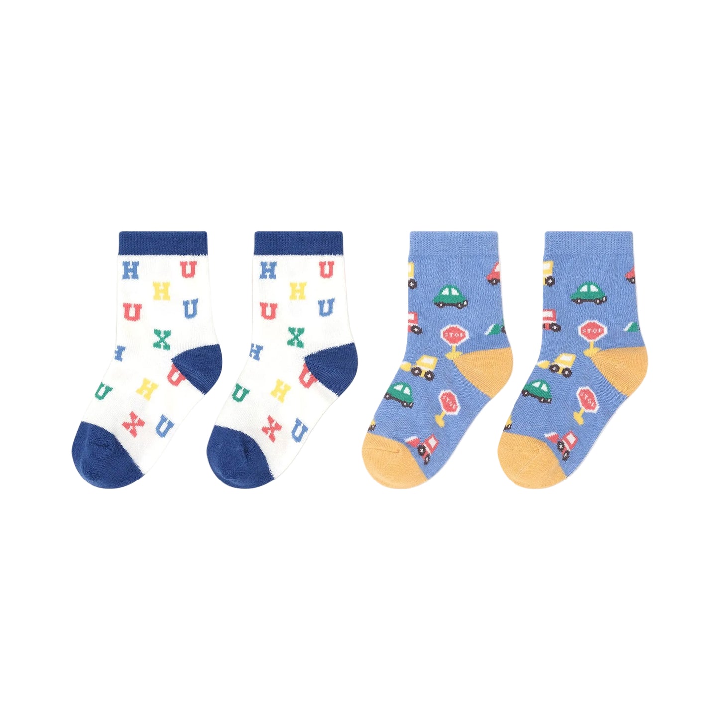 Two pairs of children's socks with colorful patterns on a beige background