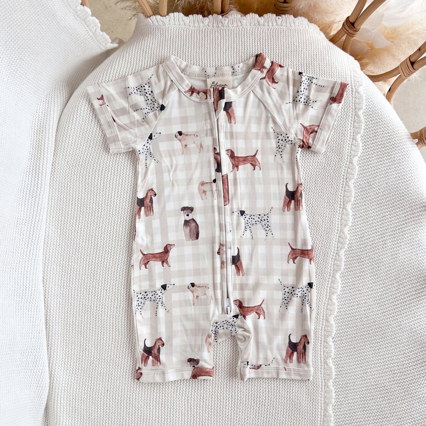 Children's outfit with dog pattern on a textured surface