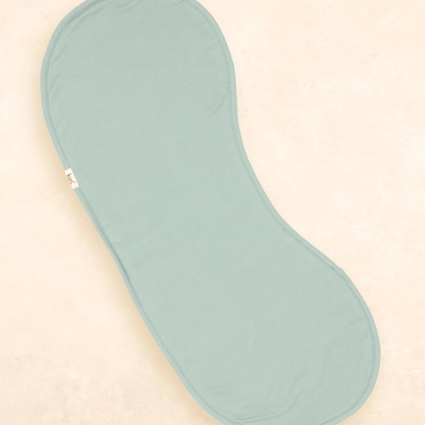 Light blue shoe insole on a beige background