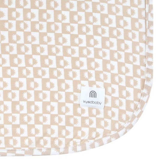 Patterned baby blanket with a visible brand label on a white background