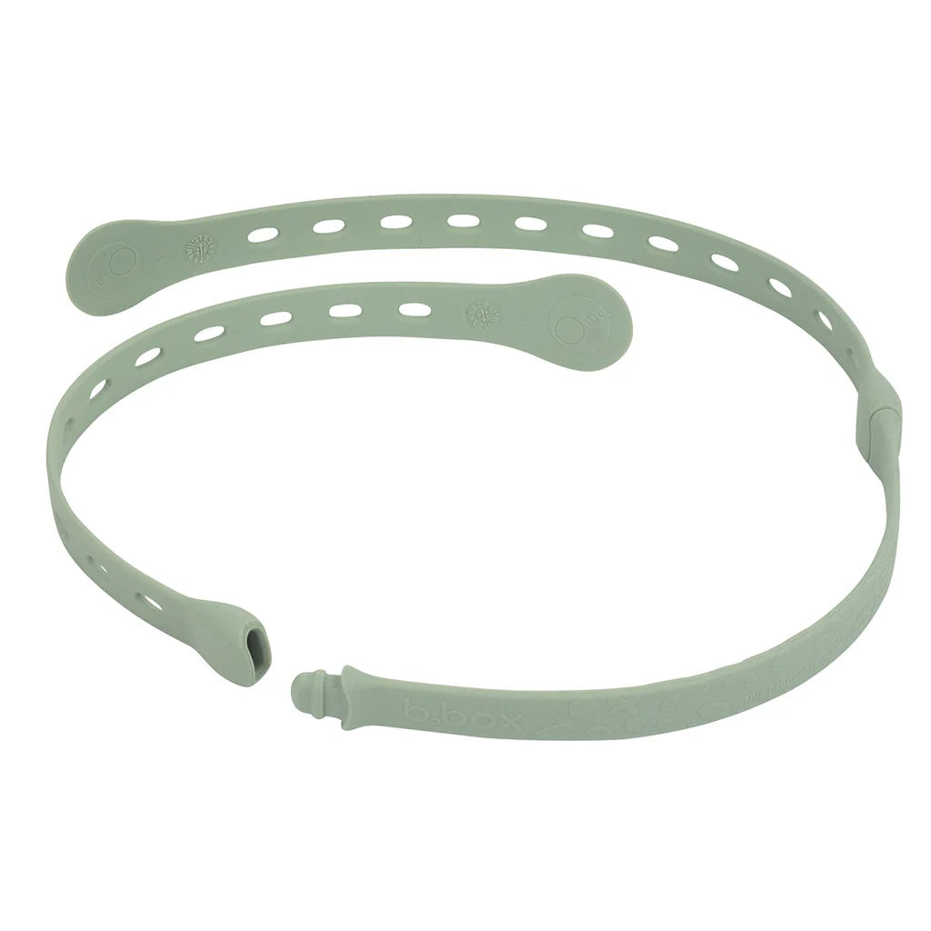 Light green silicone band with holes on a white background