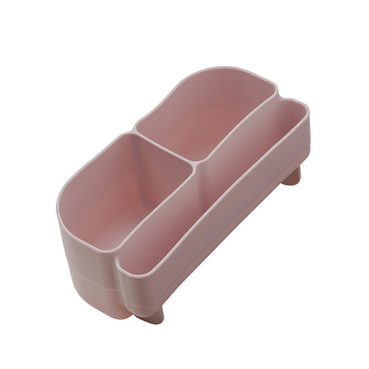 Pink plastic caddy with three compartments on a white background
