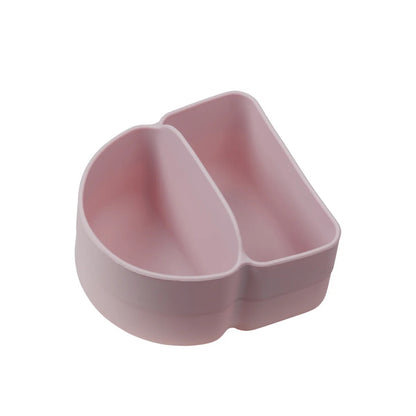 Pink silicone spoon rest on a white background