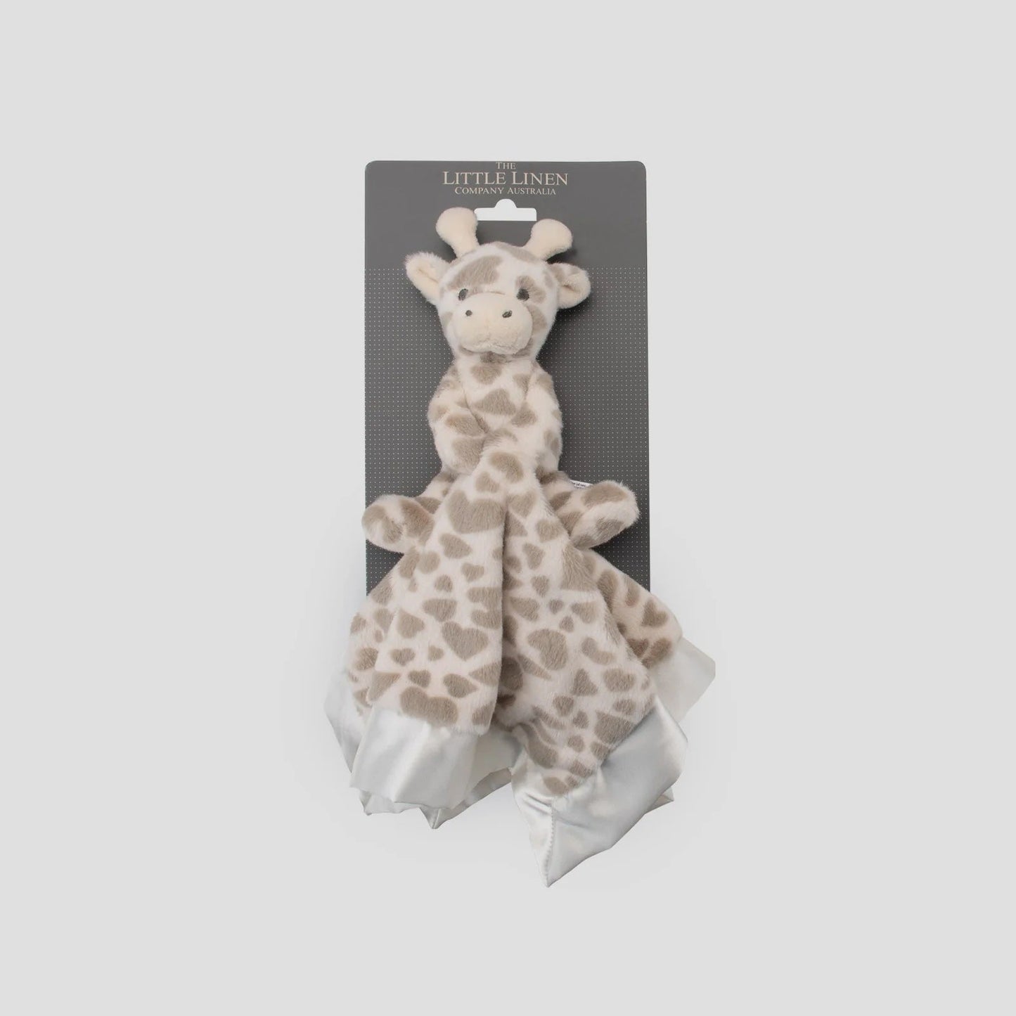 Giraffe-shaped安抚玩具在灰色包装盒中的特写