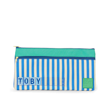 Pencil case with blue and white striped pattern and 'Toby' branding on a white background