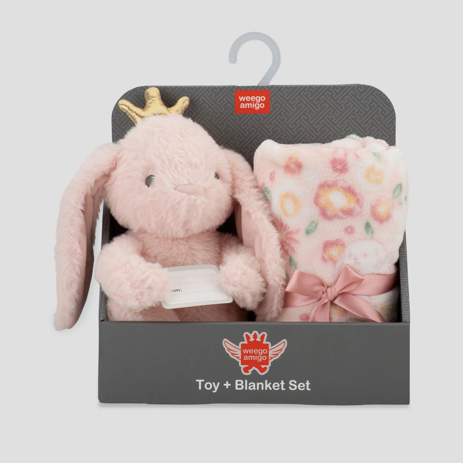 Pink plush toy with a gold crown and floral blanket in packaging on a light gray background