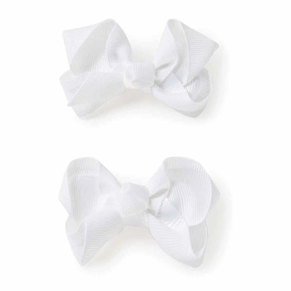 Two white hair bows on a white background