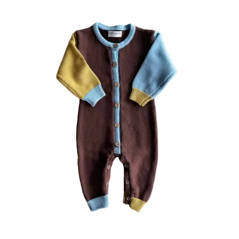 Children's brown onesie with colorful sleeves on a light gray background