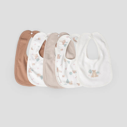 Set of five baby bibs in various colors on a light gray background