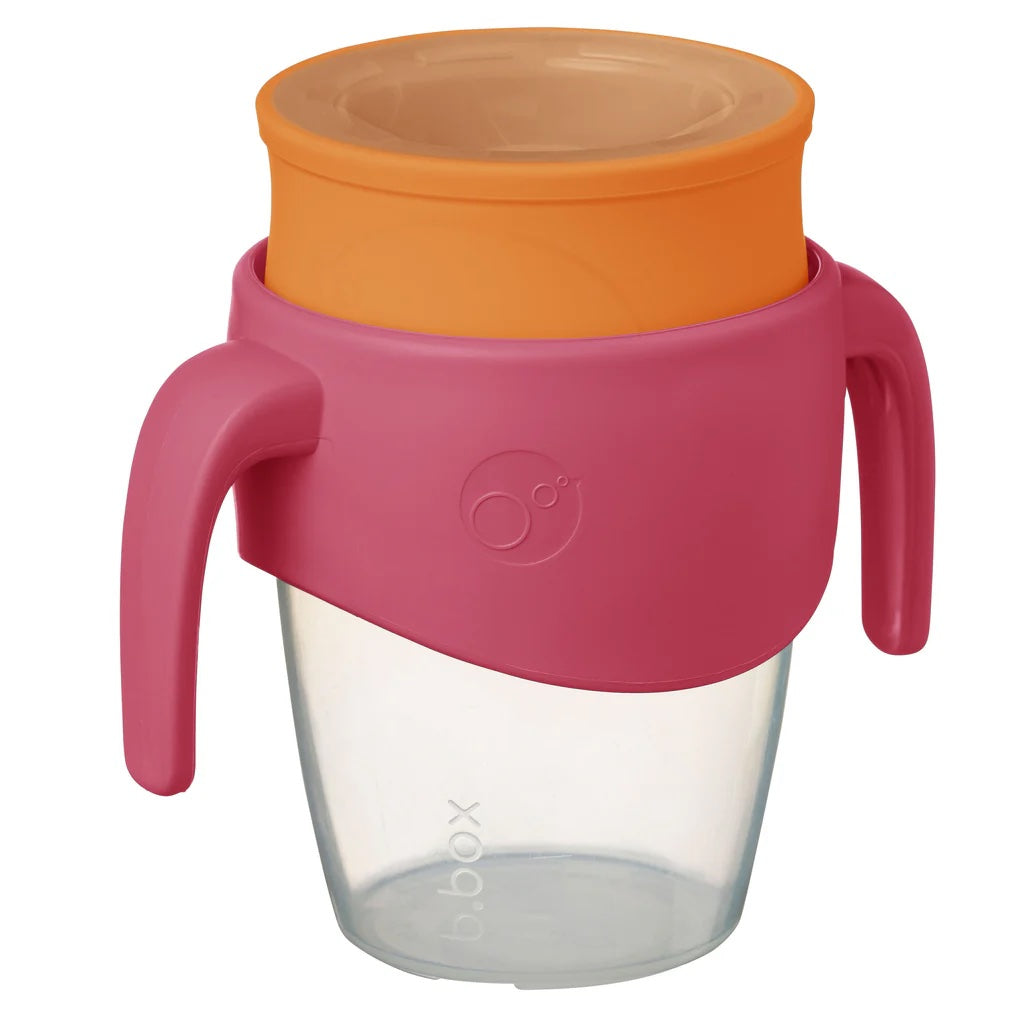 Clear cup with pink handle and orange lid on a white background