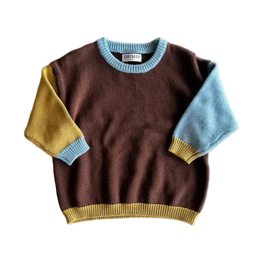 Children's sweater with color-blocked sleeves on a beige background