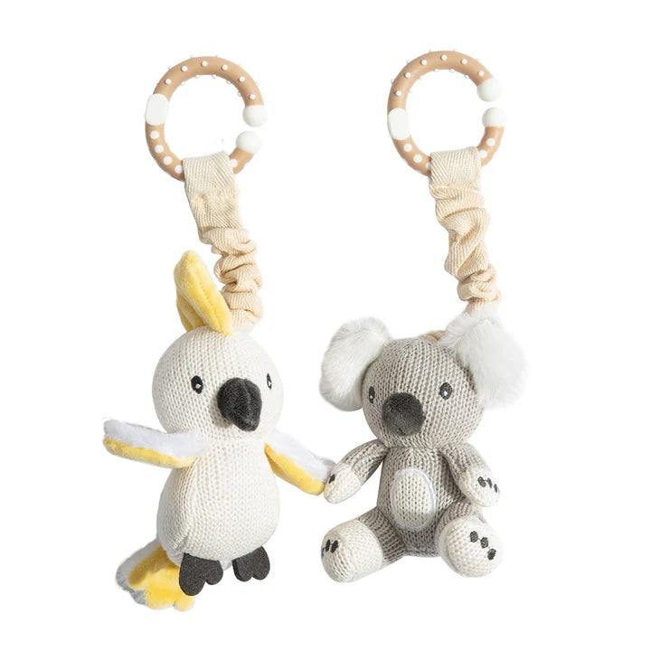 Two knitted toys, one resembling a bird and the other a koala, on a white background.
