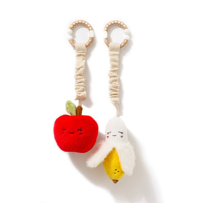 Toy with red apple and white banana design on a white background