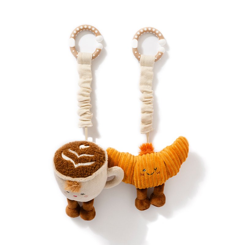 Two plush toys with straps on a white background