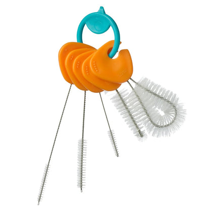 Set of orange and blue cleaning brushes with a white background