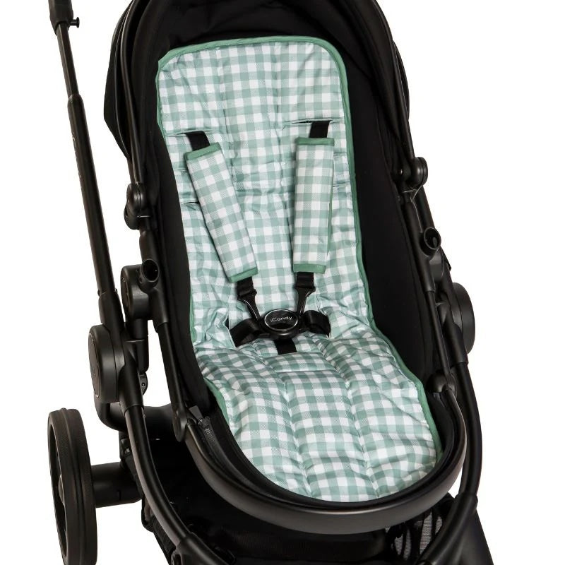 Black stroller with a green checkered seat cover on a white background