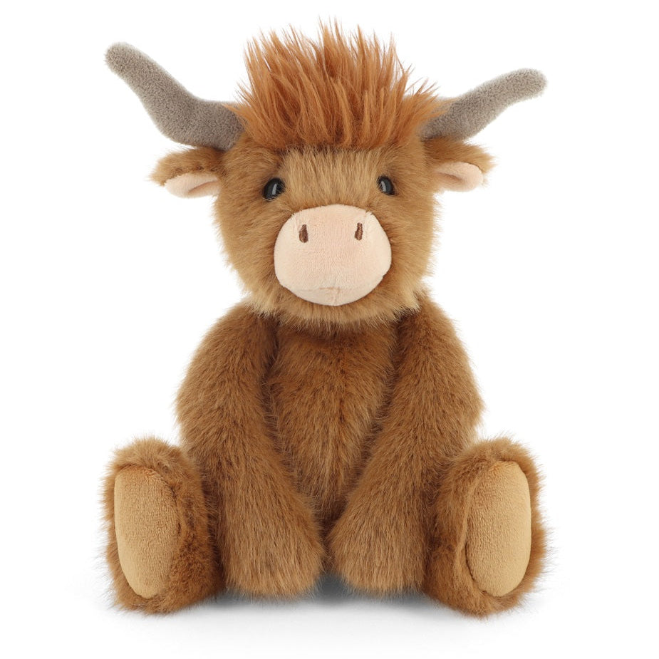 Plush toy Highland cow on a white background