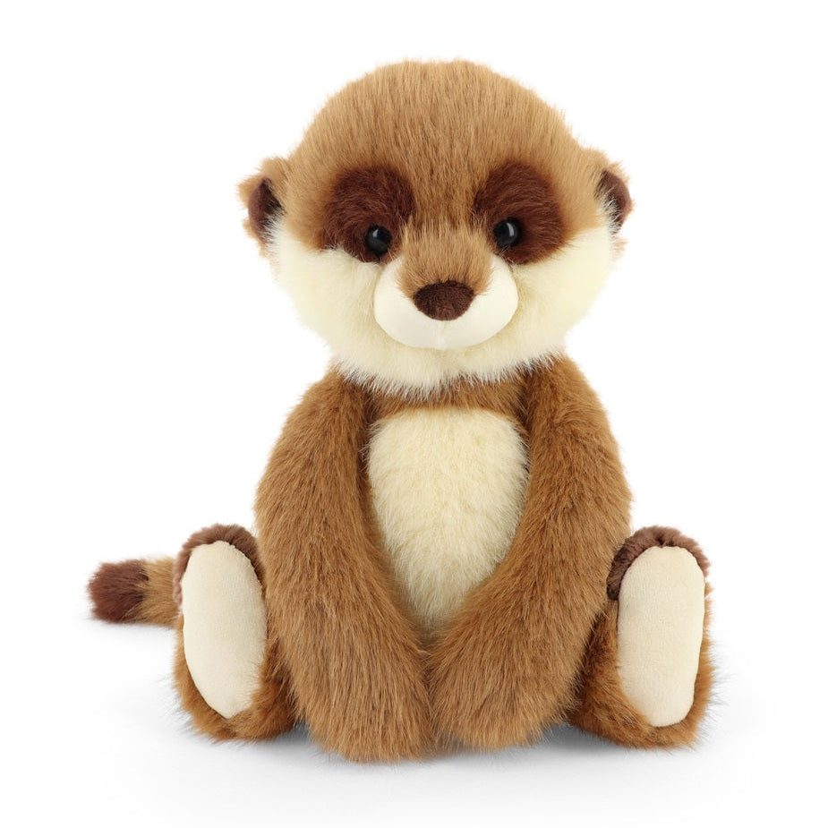 A plush toy of a sitting meerkat with brown and cream fur, photographed against a seamless white background.