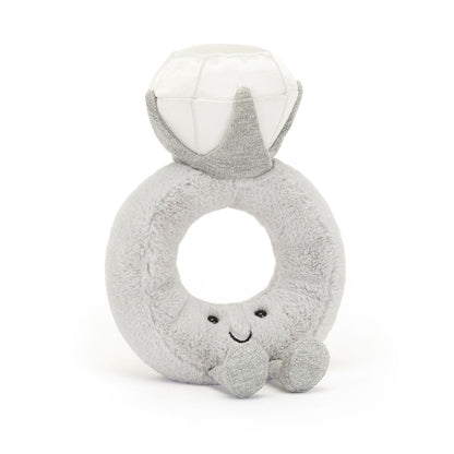 Gray plush letter 'Q' toy with a smiling face on a white background