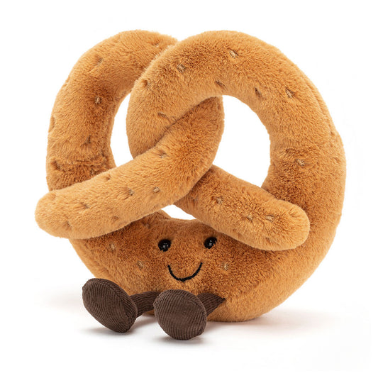 Plush pretzel toy with a smiling face on a white background