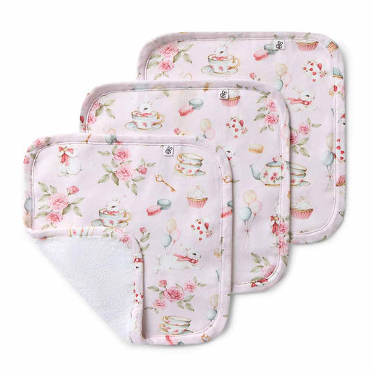 Three floral-patterned baby burp cloths on a white background