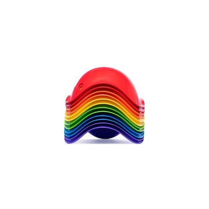 Stack of rainbow-colored silicone baking mats on a white background