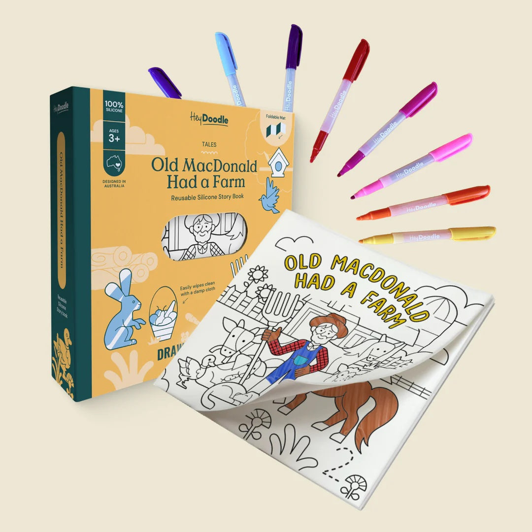 Coloring book titled 'Old MacDonald Had a Farm' with markers on a beige background
