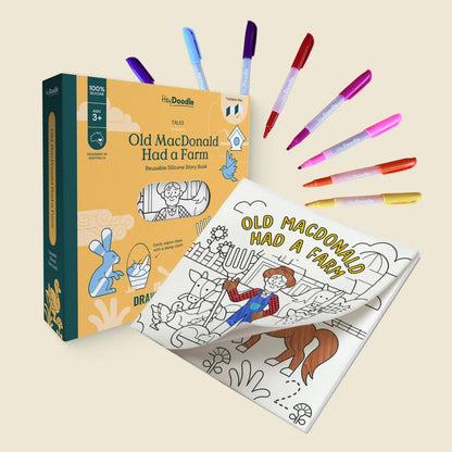 Coloring book titled 'Old MacDonald Had a Farm' with markers on a beige background