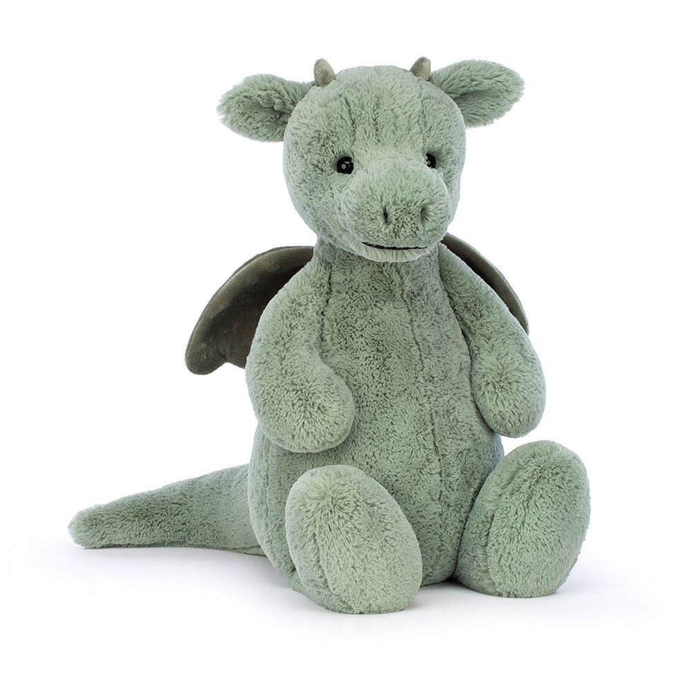 Green plush dragon toy on a white background