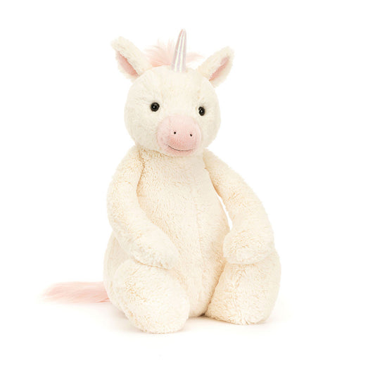 Stuffed unicorn toy on a white background