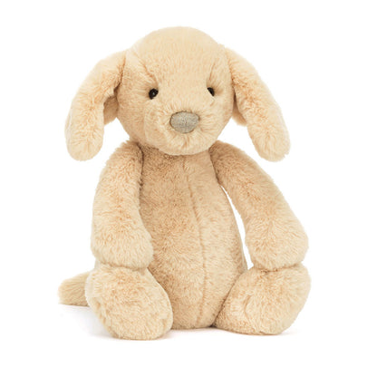 Beige plush dog toy on a white background