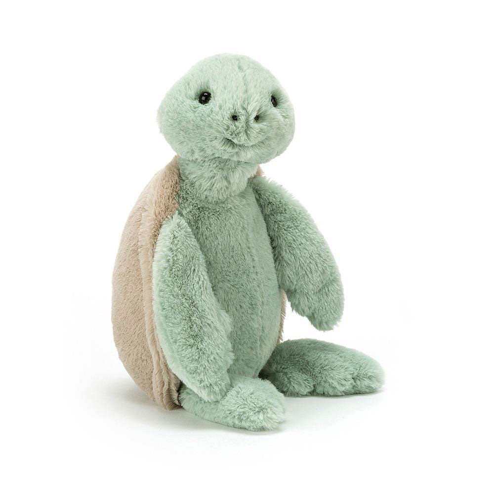 Plush turtle toy with a white background