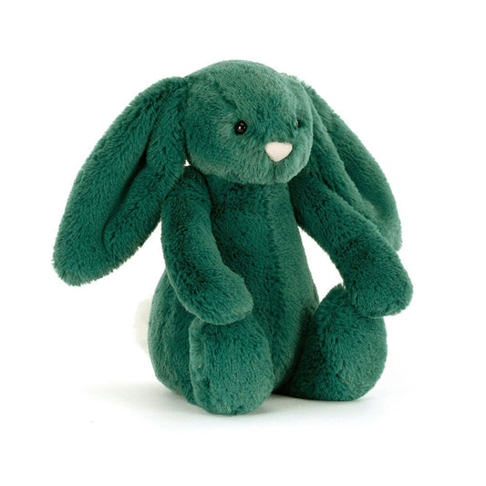Green plush bunny toy on a white background