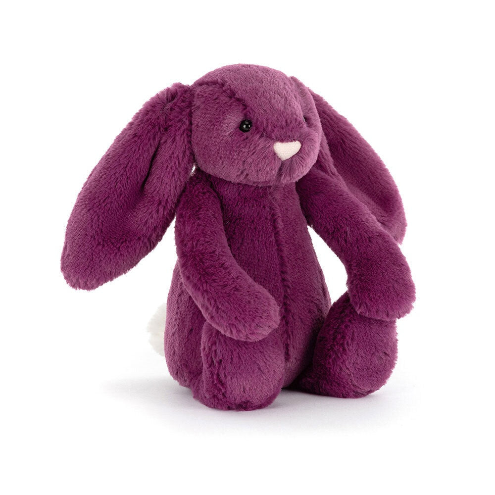 Plush bunny toy in purple on a white background