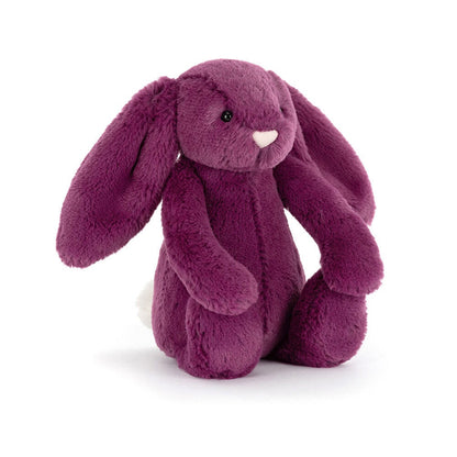 Plush bunny toy in purple on a white background