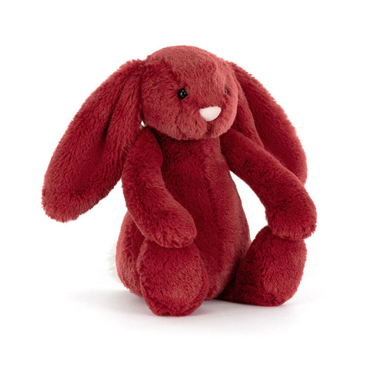 Red plush bunny toy on a white background
