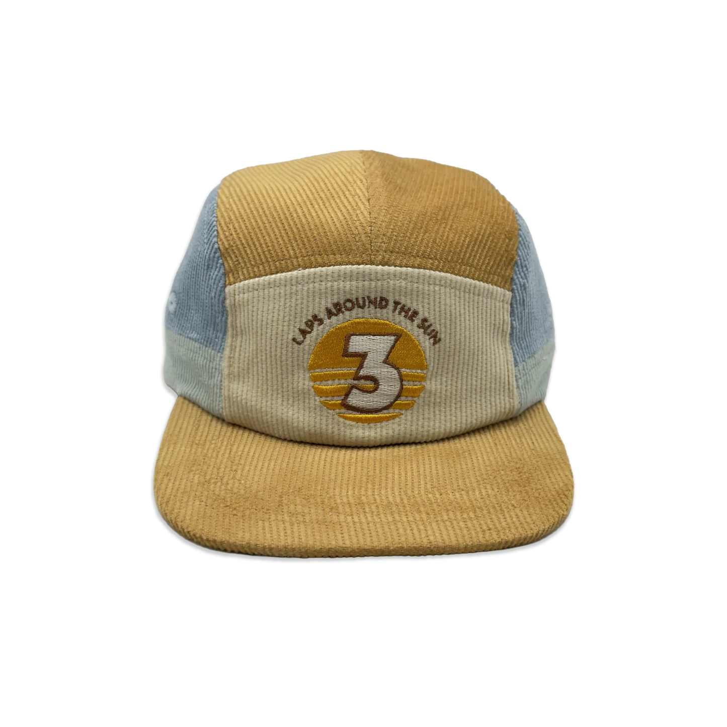 A 5-panel trucker cap made from mixed materials, featuring a mustard yellow corduroy front panel and brim, light blue mesh side panels, and a beige front patch with an embroidered circular logo.
