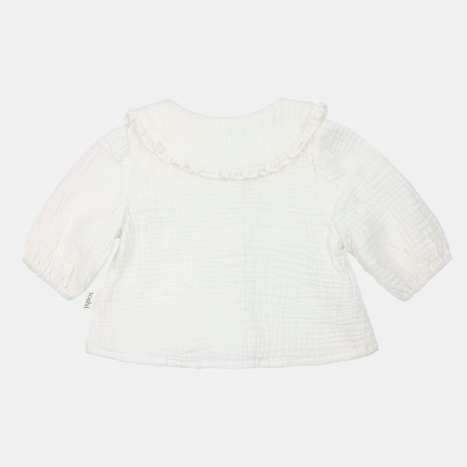 White textured top on a light beige background