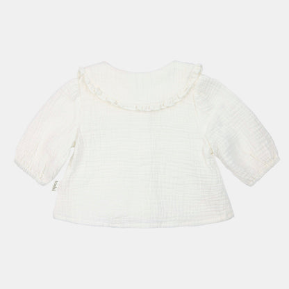 White textured top on a light beige background