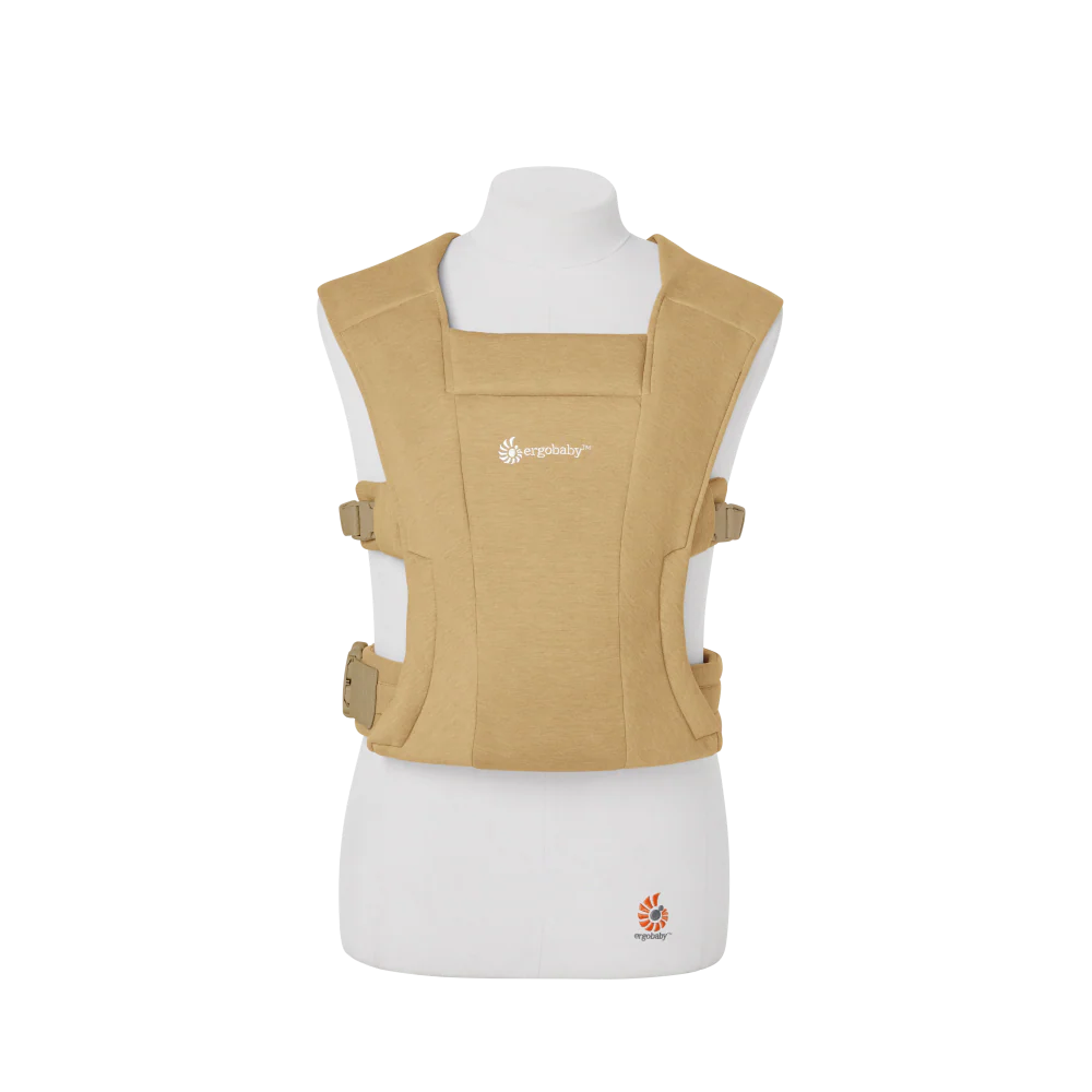 Beige baby carrier on a white mannequin with a visible brand logo.
