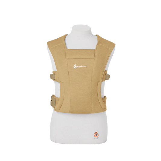 Beige baby carrier on a white mannequin with a visible brand logo.