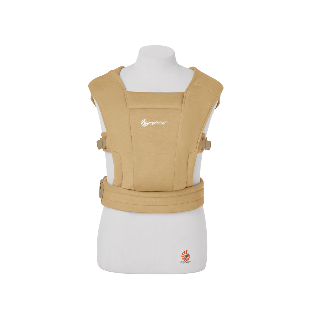 Beige baby carrier on a mannequin with a white background