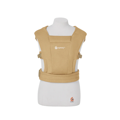 Beige baby carrier on a mannequin with a white background