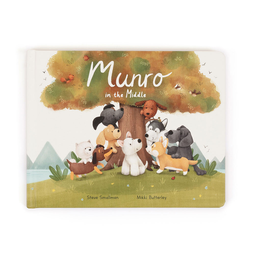 Book cover with cartoon dogs around a tree and 'Munro in the Middle' text on a white background