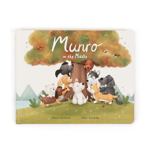 Book cover with cartoon dogs around a tree and 'Munro in the Middle' text on a white background