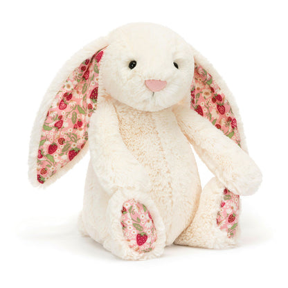 Plush bunny toy with floral ears on a white background