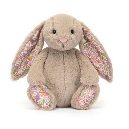 Plush bunny toy with floral ears and paws on a white background