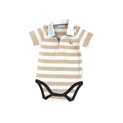 A baby short-sleeve polo romper with beige and off-white horizontal stripes, featuring a white collar, a short button placket, and black snap closures at the crotch. A small black embroidered monogram 'LH' is visible on the chest.