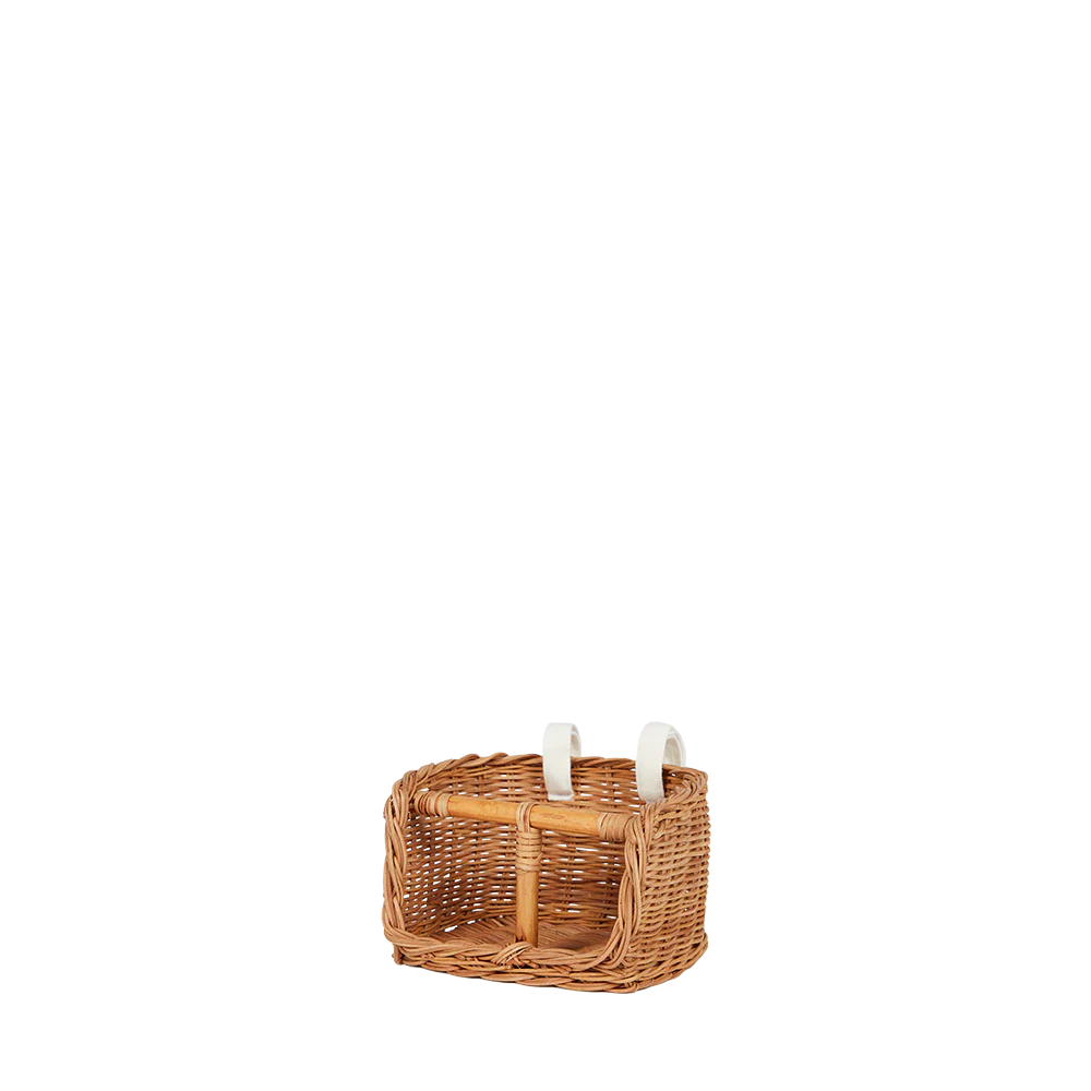 Wicker basket with candles on a white background